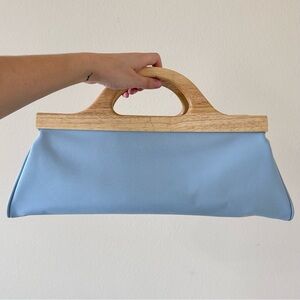 Pastel blue statement handbag with wooden handles